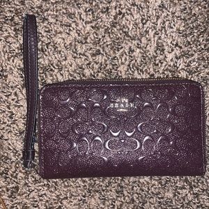 Purple Coach wallet with wristlet